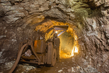 Canvas Print - Underground gold mine shaft tunnel drift with rails