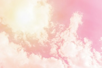 Wall Mural - Sunny orange pink sky background. Beautiful warm sky with clouds. Toned photo