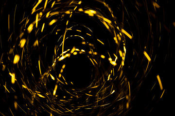 Wall Mural - abstract texture of Golden sparkles on a black background, Golden highlights in the form of spirals and iridescence