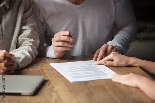 Fotomural Close up of couple sign contract at meeting with realtor