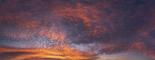 Panorama Of Cloudscape At Sunset With Red Clouds On Sky