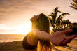 © simona - Healthy people lifestyle enjoying sunset and fitness activity alone - beautiful woman feel the sun and the ocean oxygen after workout sport session class - open arms and freedom breathe