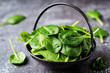 © nata_vkusidey - Raw fresh spinach leaves on a stone background