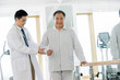 © View Stock - The doctor helps the patient rehabilitation exercise