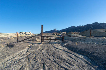 Poster - View of a closed flow track coming down the hills in Death Valley California