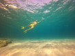 © Enrique - underwater man snorkeling in the sea withcrystal-clear waters concept of holiday relax summer beach diver in the sea