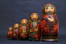 Traditional Russian Matryoshka Dolls Lined Up Against Gray Background, Doll Within A Doll, Object Within An Object, Metaphor For Shell Companies, Russian Nesting Doll 4