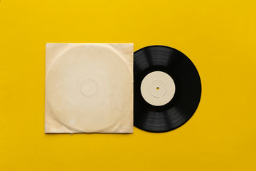 the mockup template with the new vinyl disc on color surface, music album cover design
