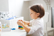 © natalialeb - girl child plays with wooden educational toy