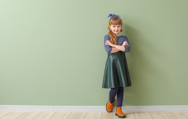 Wall Mural - Cute fashionable girl on color background