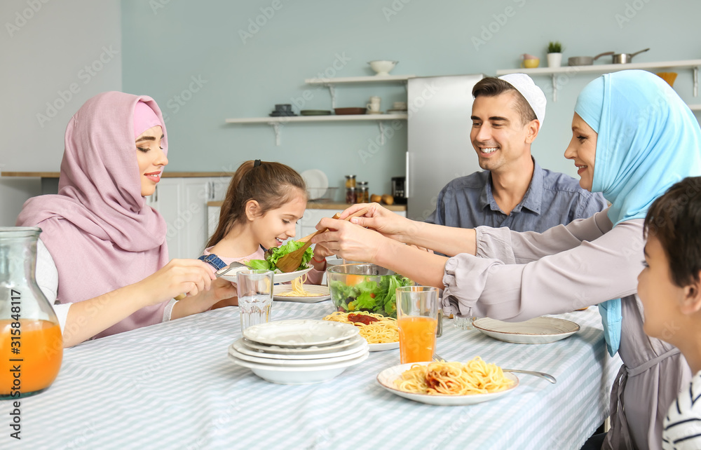 Muslim family having dinner at home