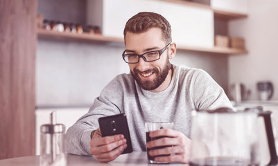close up. man reading e-mails during Breakfast