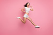 Full length body size view of her she nice attractive lovely dreamy purposeful cheerful cheery wavy-haired girl jumping having fun running fast isolated over pink pastel color background
