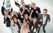 © ASDF - top view. a large group of young employees showing their success