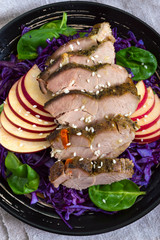 Wall Mural - Baked turkey breast with red cabbage salad, spinach, apples. Useful lunch. Dietary dish. Proper nutrition. The top view. Close up