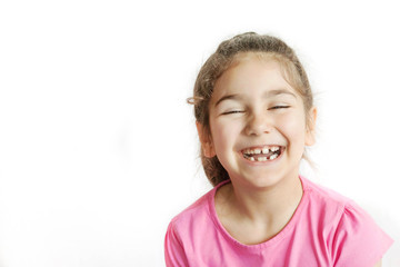 Portrait of happy smiling child girl isolated on white background. Laughing people. Positive emotions.