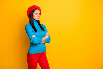 Profile side view portrait of her she nice attractive pretty serious content fashionista girl wearing cozy comfort clothes folded arms isolated over bright vivid shine vibrant yellow color background