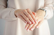© VI Studio - Spa and Manicure concept. Hands of a young girl with beautiful french manicure. Beautiful french manicure.
