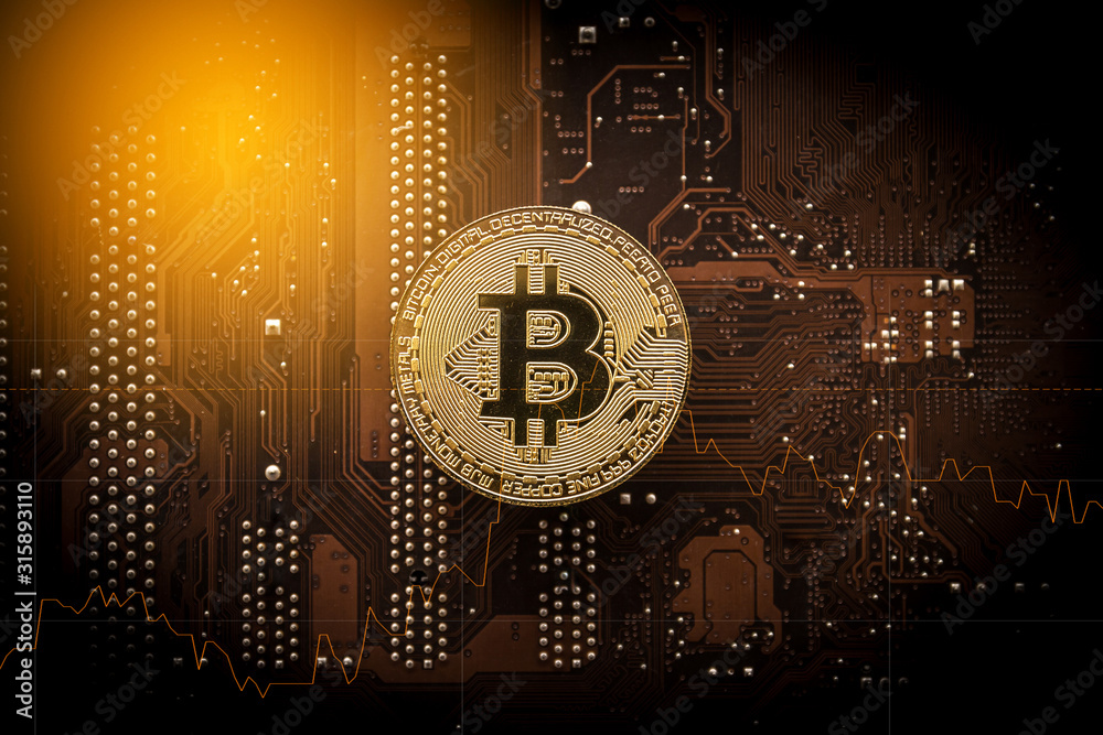 Gold bitcoin on computer mainboard with trading graph, Mining and trade ...