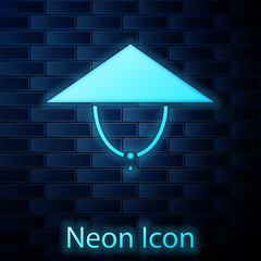 Glowing neon Asian conical hat icon isolated on brick wall background. Chinese conical straw hat. Vector Illustration