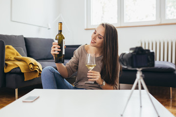 woman making video blog about wines