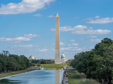 Washington, District Of Columbia, United States Of America - Washington Monument Park, Obelisk On National Mall, American Flags And US Capitol