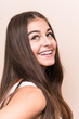 © Asier - Young cute caucasian woman against a beige background