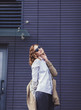 © jozzeppe777 - fashion model with curly hair wearing sunglasses posing outdoor