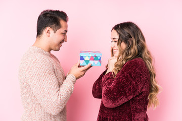 Young latin couple with a present