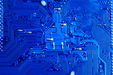 Wall Mural - blue circuit board background of computer motherboard,Electronic computer hardware technology.Integrated communication processor. Information engineering component. Blue color.