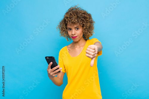 Cuadros en Lienzo young african american feeling cross, angry, annoyed, disappointed or displeased