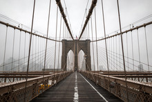 Views Of The Brookln Bridge On A Cold And Foggy Morning In New York City.