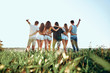 © HBS - A group of people huddle in a field.