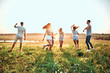 © HBS - Happiness Friends funny dance on the field under sunset sunlight in summer sunny day.