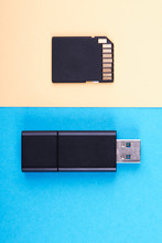 Usb Flash Stick And Micro Sd Memory Card On Blue And Yellow Background. Different Kind Of Portable Storage Devices. Data Store Concept.