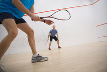 Men Playing Squash On Court