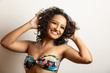© Brastock Images - Beauty Fashion Model Girl with Curly Hair and Colorful Makeup. Afro woman smiling