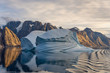 Beautiful view to iceberg at sunset from expedition vessel in Greenland fjord