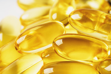 Wall Mural - Omega 3 vitamin supplement gel capsules, medicine Fish Oil background, macro photo close-up.