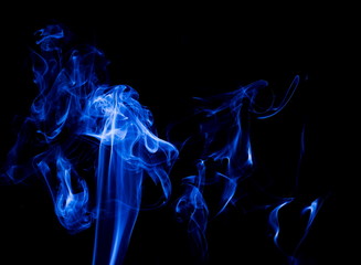 Blue smoke on black background