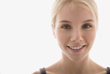 Close Up Portrait Of Smiling Young Blonde Woman