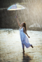 Pretty Young Woman With Rainbow Umbrella, Under Summer Rain