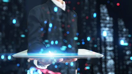Poster - 3D rendering of blue light flare and blur lights from city at night overlay on businessman holding tablet. Concept for business presentation, technology advancement, leadership