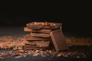 Milk chocolate stack on dark background