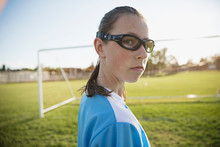 Portrait Confident Middle School Girl Soccer Player Wearing Goggles On Field