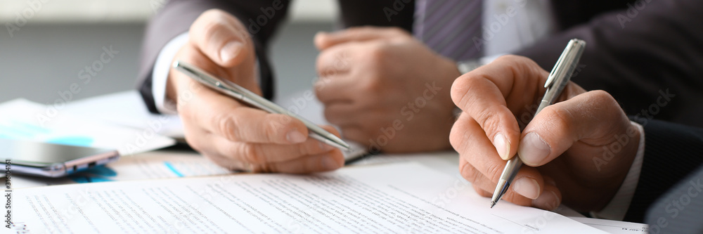 Male arm in suit and tie fill form clipped pad with silver pen closeup. Sign gesture read pact sale agent bank job make note loan credit mortgage investment finance executive chief legal teamwork law - obrazy, fototapety, plakaty 