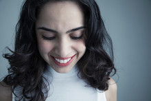 Close Up Portrait Smiling Brunette Latina Young Woman Looking Down