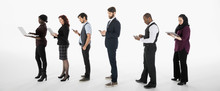 Business People Using Cell Phones, Digital Tablets And Laptop In A Row Against White Background