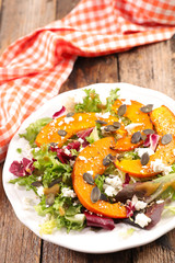 Wall Mural - vegetable salad with roasted pumpkin slices, cheese and lettuce