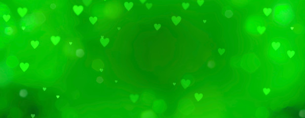 Wall Mural - abstract green background with bokeh in heart shape - st. patricks day and love concept